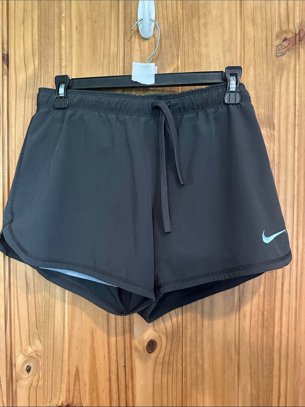 Nike Women's Black Athletic Shorts with Light Blue Swoosh